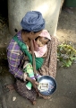 BEGGAR WITH BABY IN MARKET AT BAGAN