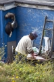 INUIT MAN PREPARING FISH