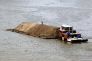 BARGE CARRYING SOIL ON SAIGON RIVER